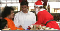 Sai Baba with Santa Claus Sai Kulwant hall centre stage, Prasanthi Nilayam